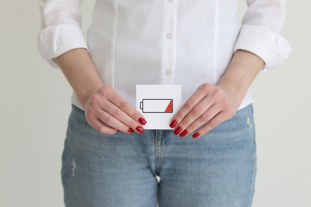 Woman,In,Jeans,And,Casual,Shirt,Shows,Discharged,Battery,Cell